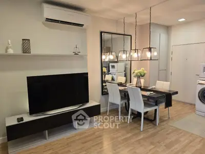 Modern living room with dining area, featuring sleek furniture and ambient lighting.