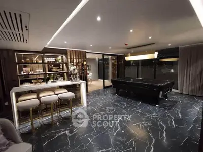Luxurious modern living room with marble flooring and elegant bar area
