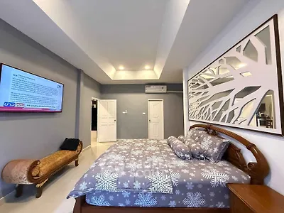 Spacious bedroom with elegant decor and modern amenities in a luxurious real estate property.