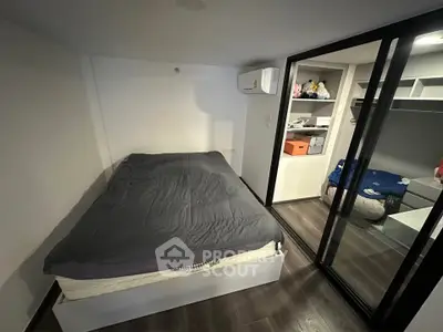 Cozy bedroom with modern closet and air conditioning