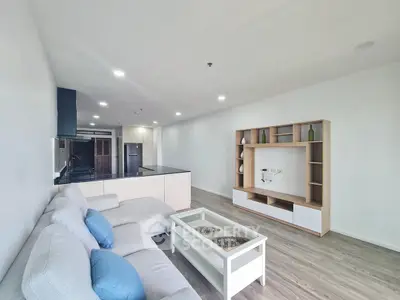 Spacious modern living room with open kitchen and stylish furniture