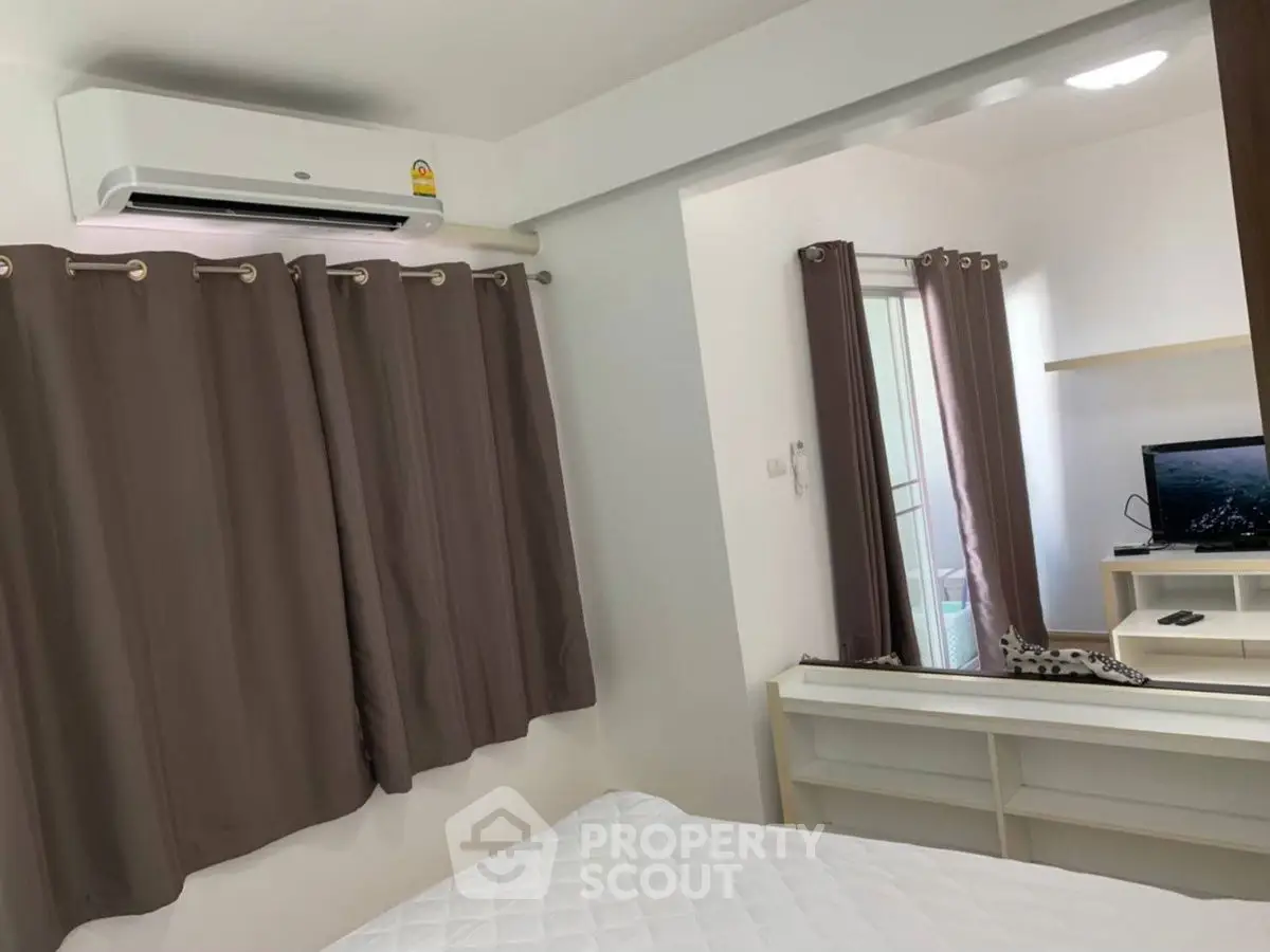 Cozy bedroom with air conditioning and modern decor in a stylish apartment.