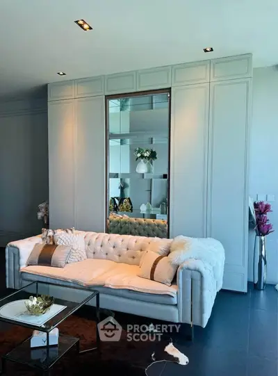 Luxurious living room with elegant sofa and stylish decor, perfect for modern living.