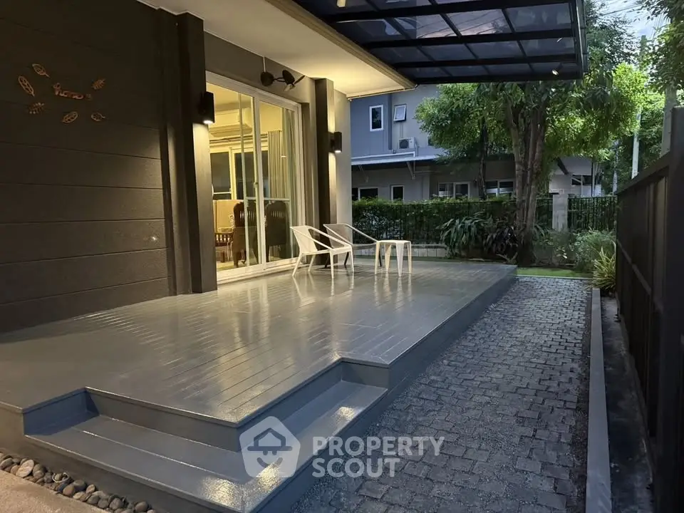 Modern patio with sleek design and cozy seating area