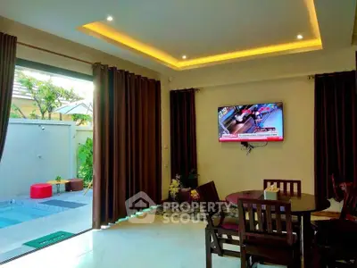 Luxurious living room with pool view and modern interior design