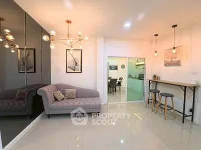 Stylish modern living room with elegant lighting and cozy seating area