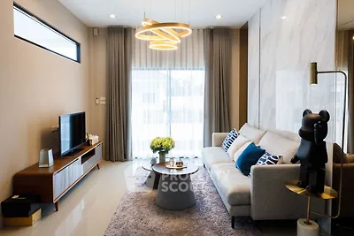 Modern living room with stylish decor and cozy seating area.