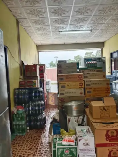 Spacious storage room filled with boxes and supplies, ideal for business inventory needs.