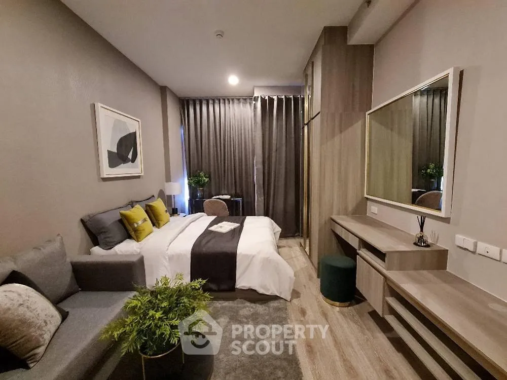 Modern bedroom with stylish decor and cozy ambiance in a contemporary apartment.
