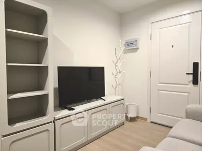 Modern living room with sleek TV setup and stylish shelving