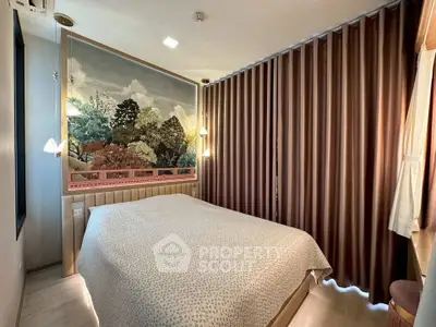 Cozy bedroom with elegant wall art and warm lighting, perfect for relaxation.