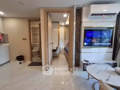 Modern apartment interior with open layout, featuring a sleek kitchen, cozy living area, and stylish bedroom.