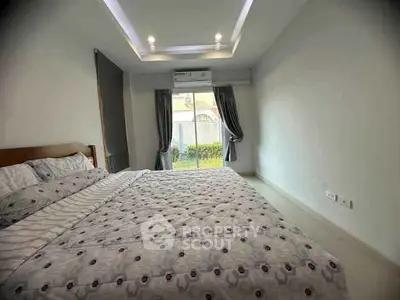 Spacious bedroom with modern design and garden view