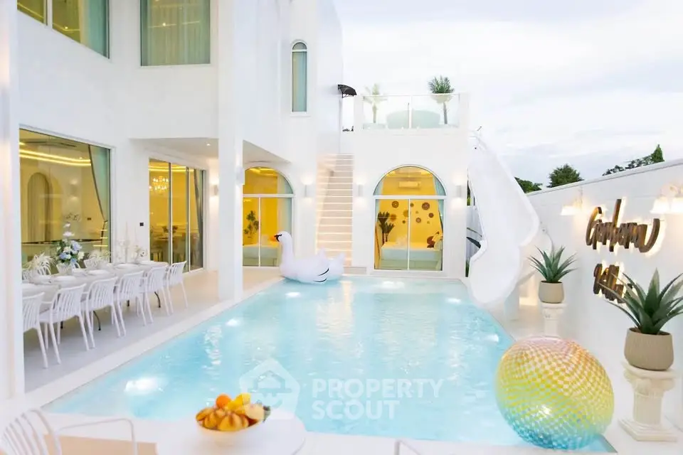 Luxurious modern villa with private pool and elegant outdoor dining area