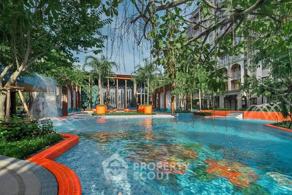 Luxurious outdoor pool surrounded by lush greenery and elegant architecture, perfect for relaxation and leisure.
