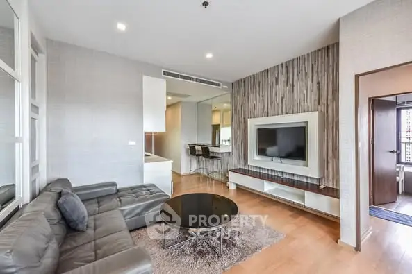 Modern living room with sleek design and open layout in a stylish apartment.