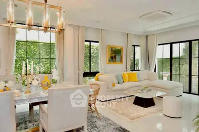 Luxurious open-plan living room with elegant dining area and large windows