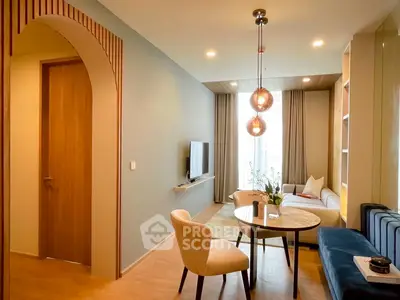 Modern living room with stylish decor and elegant lighting in a cozy apartment.