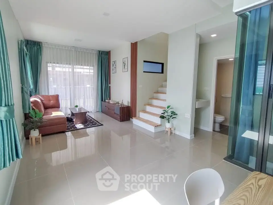 Spacious living room with modern decor and natural light