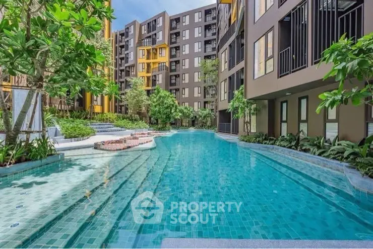 Luxurious residential complex with stunning pool and lush greenery