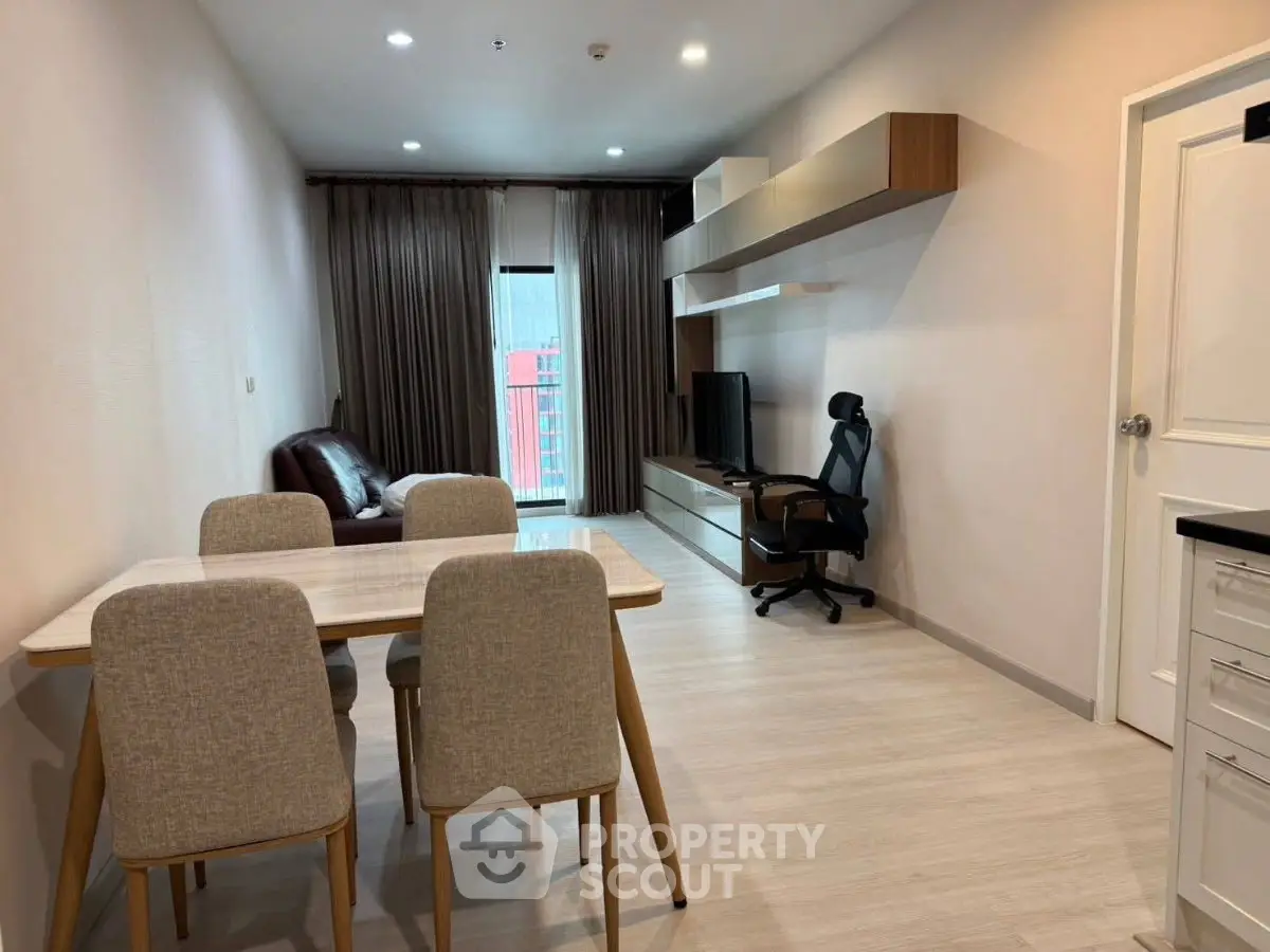 Modern living room with sleek furniture and natural light, perfect for urban living.