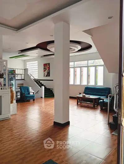 Spacious living room with modern decor and natural light