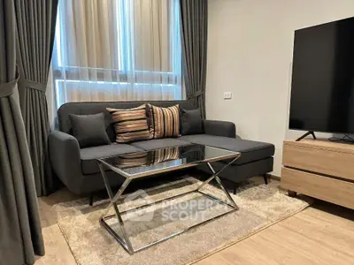 Modern living room with sleek sofa and glass coffee table in stylish apartment