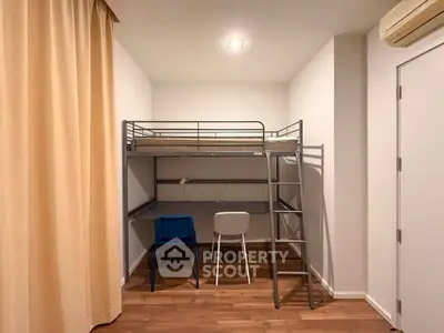 Modern loft bed with study area in compact room, featuring wooden flooring and minimalist design.