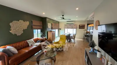 Stylish open-concept living room with leather sofa and modern decor