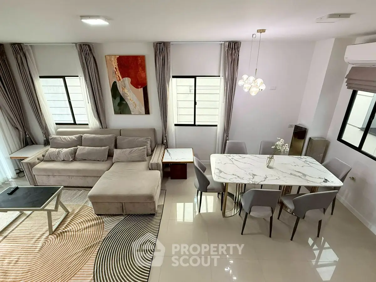 Modern living and dining area with stylish decor and natural light
