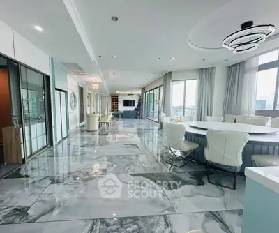 Luxurious open-plan living room with marble floors and panoramic city views