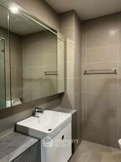 Modern bathroom with sleek design and large mirror