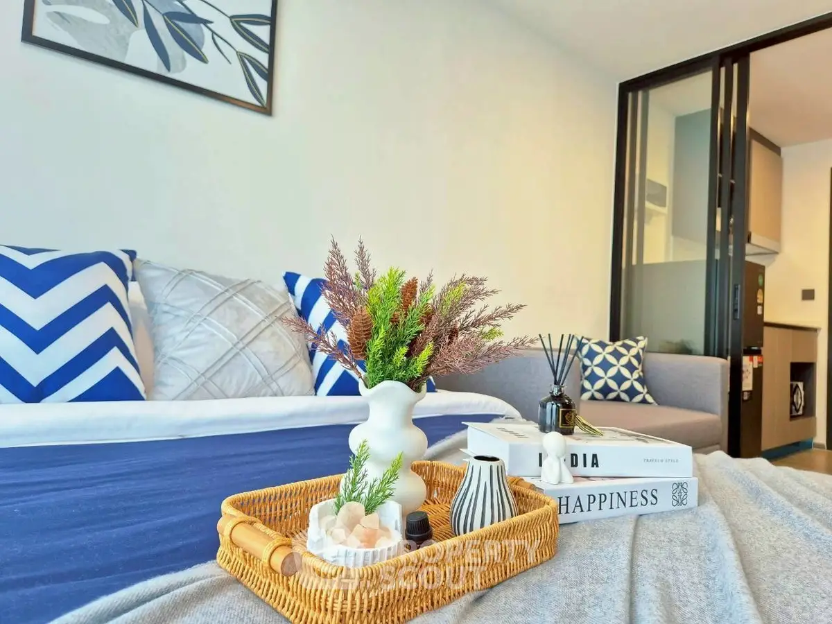 Modern living room with stylish decor and cozy ambiance, featuring a comfortable sofa and elegant accessories.