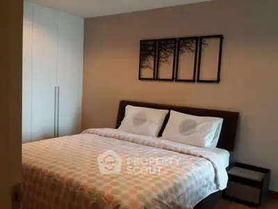 Cozy bedroom with modern decor and ample storage space