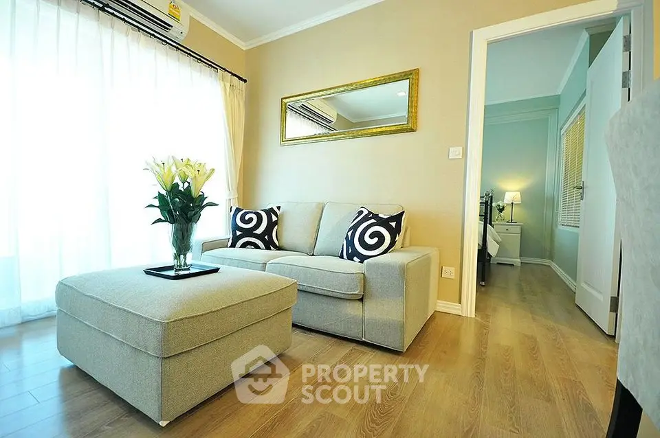 Elegant living room with cozy sofa and stylish decor in modern apartment
