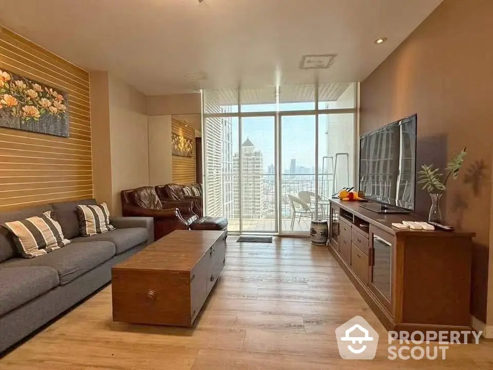 Spacious living room with modern decor and city view balcony