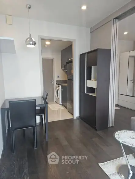 Modern apartment interior with sleek kitchen and dining area