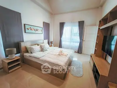 Spacious modern bedroom with elegant decor and natural light