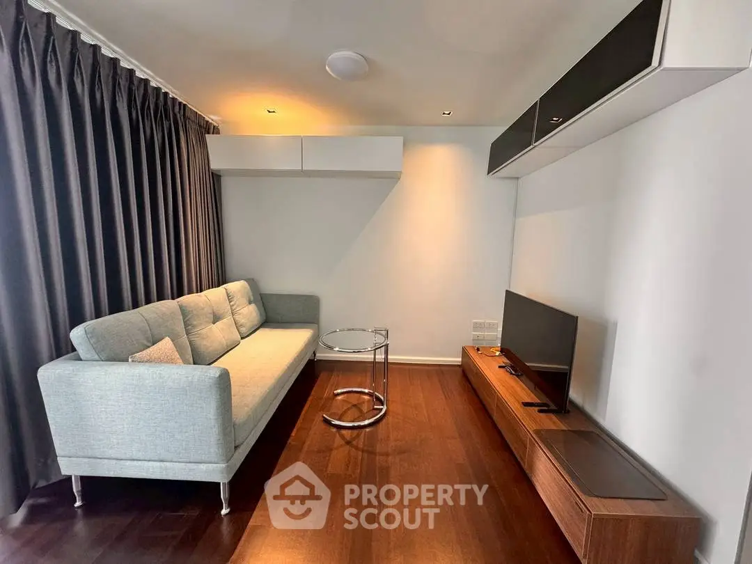 Modern living room with sleek furniture and wooden flooring