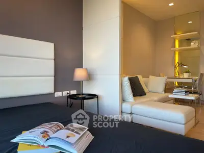 Modern bedroom with cozy seating area and stylish decor