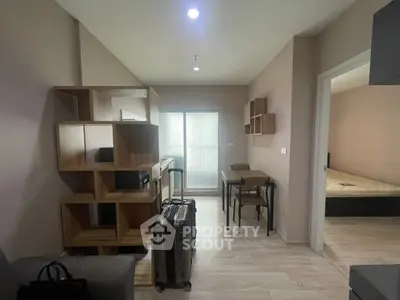 Modern apartment interior with stylish shelving and dining area