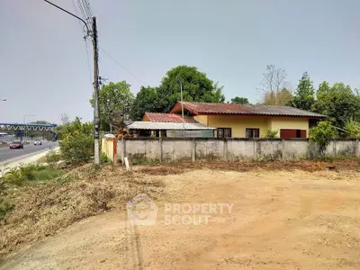 Charming countryside home with spacious yard and lush greenery, perfect for serene living near the highway.
