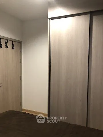 Cozy bedroom with sliding closet doors and soft lighting