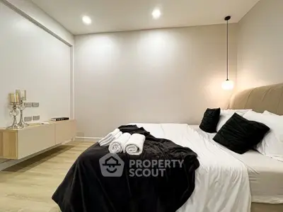 Luxurious modern bedroom with elegant decor and cozy ambiance