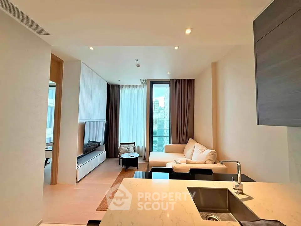 Modern living room with city view, featuring elegant decor and spacious layout.