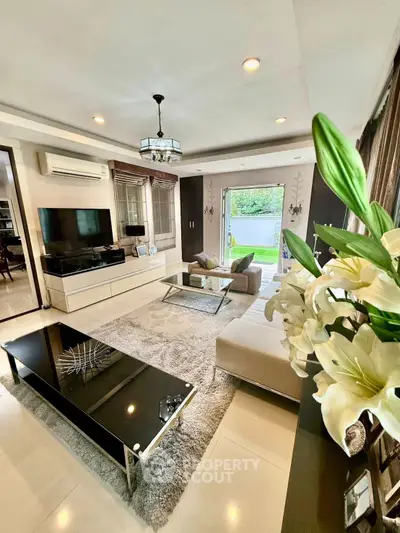 Luxurious living room with modern decor and garden view