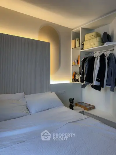 Modern bedroom with stylish headboard and open closet design