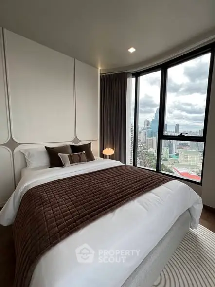 Luxurious bedroom with panoramic city view and elegant decor