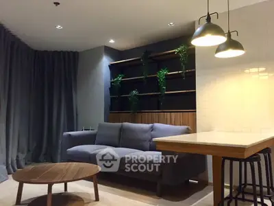Modern living room with stylish sofa, wooden coffee table, and elegant lighting in a cozy apartment.