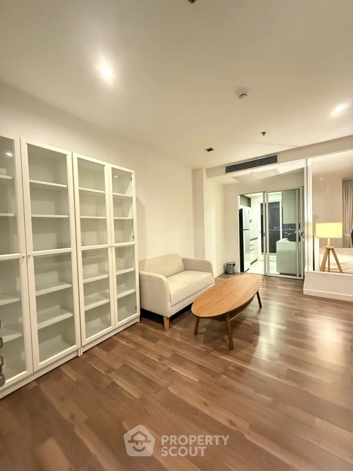 Spacious living room with modern furniture and wooden flooring